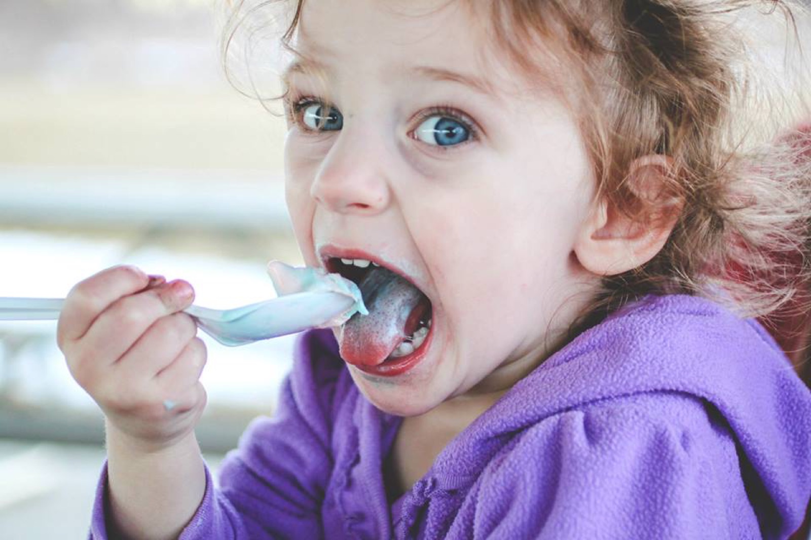 A young child developing healthy eating and swallowing skills