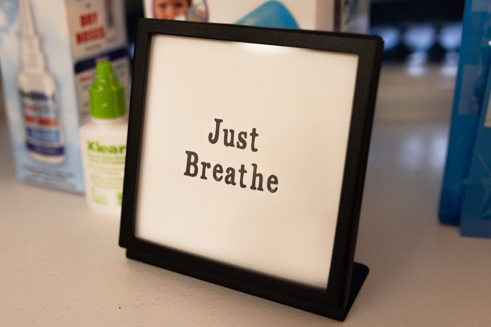 A "Just Breathe" sign in the Digits & Spots office