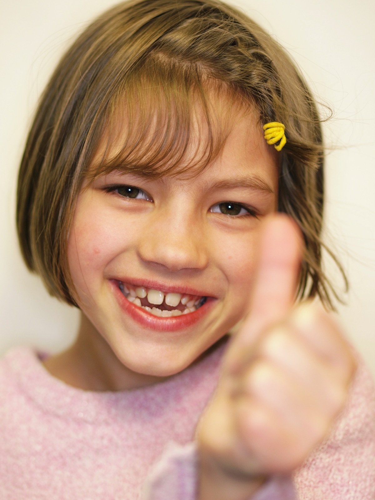 Close-up of a child with fingers resting in the mouth